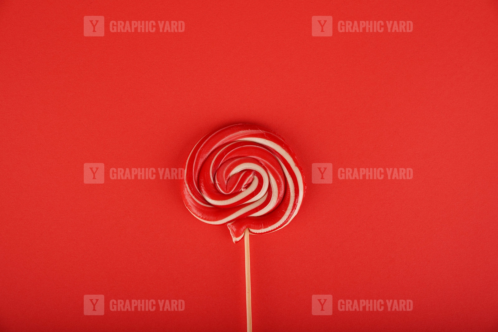 https://graphicyard.com/wp-content/uploads/2020/07/Delicious-swirl-lollipop-isolated-on-red-background.jpg